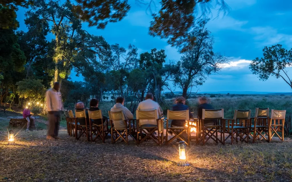 5 Days Kenya Vacation. Kenya safari holiday. Guests enjoying picnic lunch by the Mara River. Masai mara trip cost.
