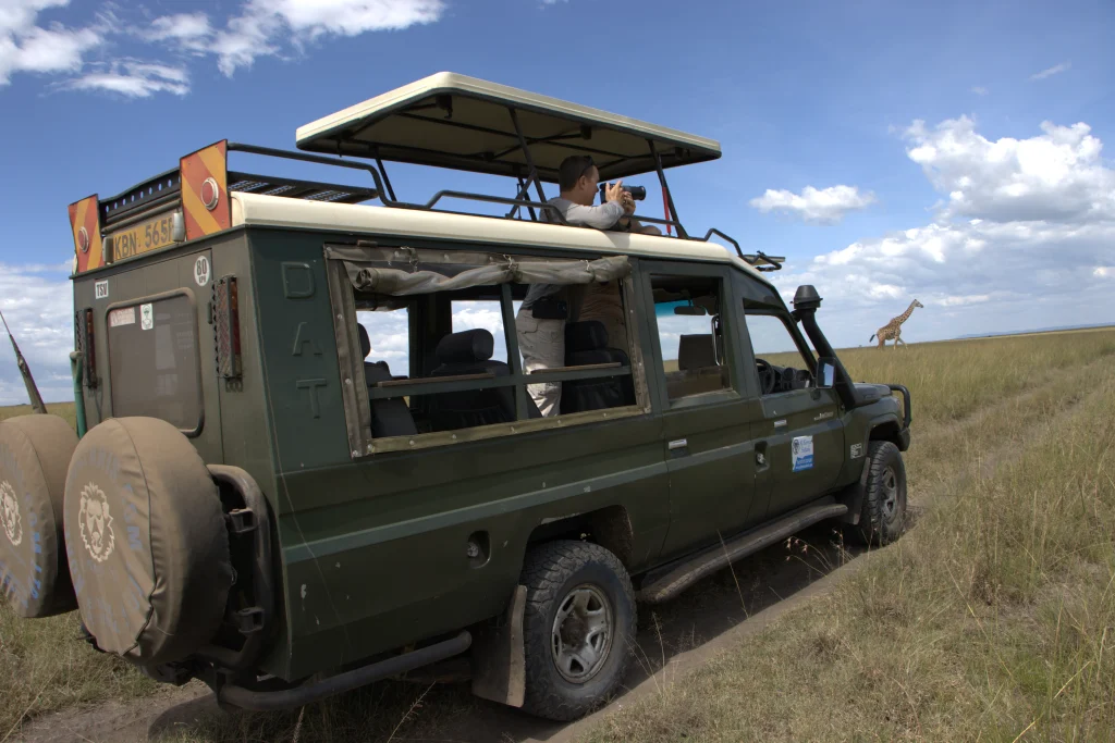 Kenya- tourists on a game drive in the Mara